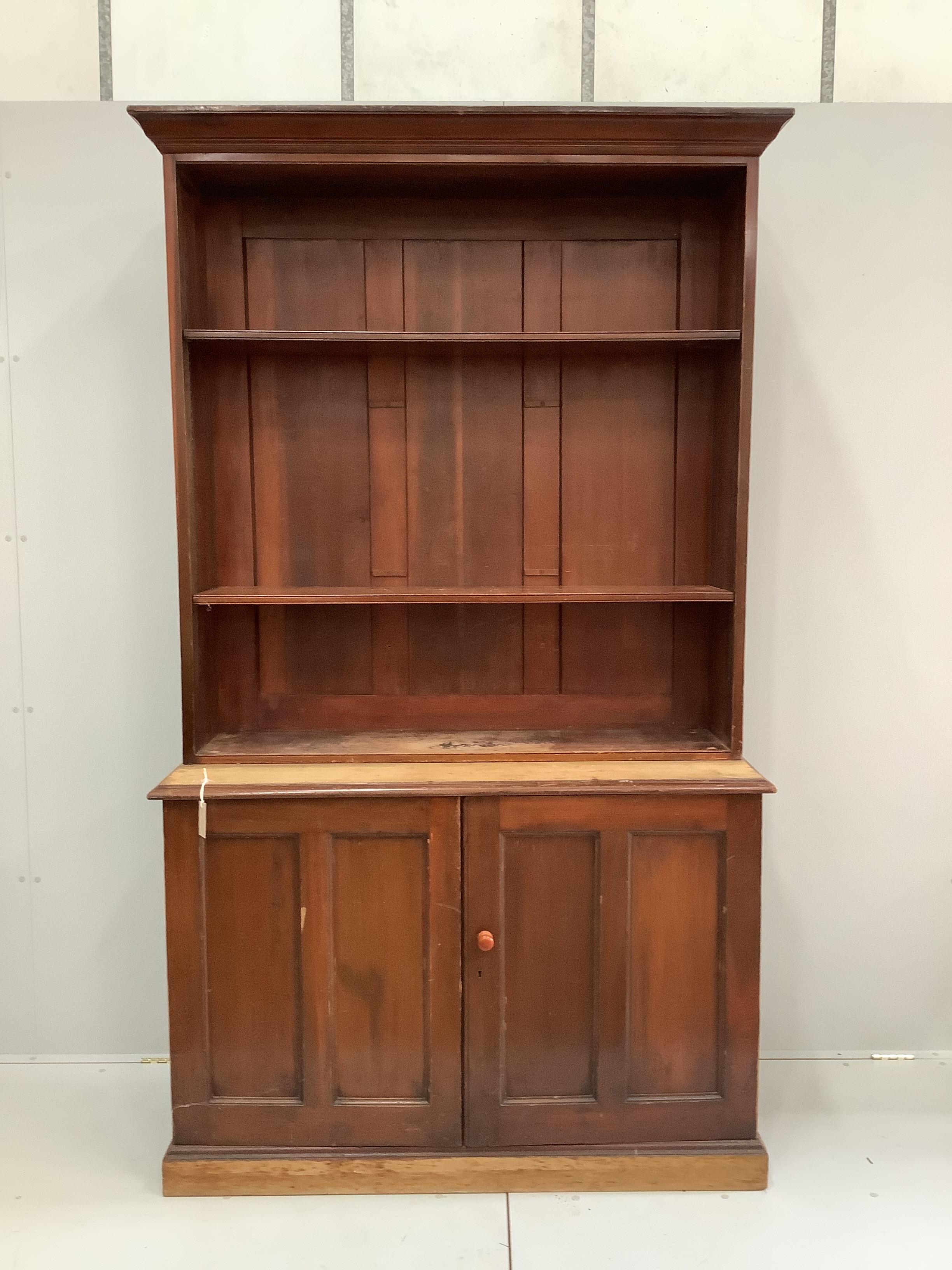 A Victorian mahogany bookcase cupboard, width 127cm, depth 47cm, height 221cm
